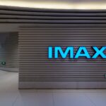 Blue imax sign on a modern cinema wall