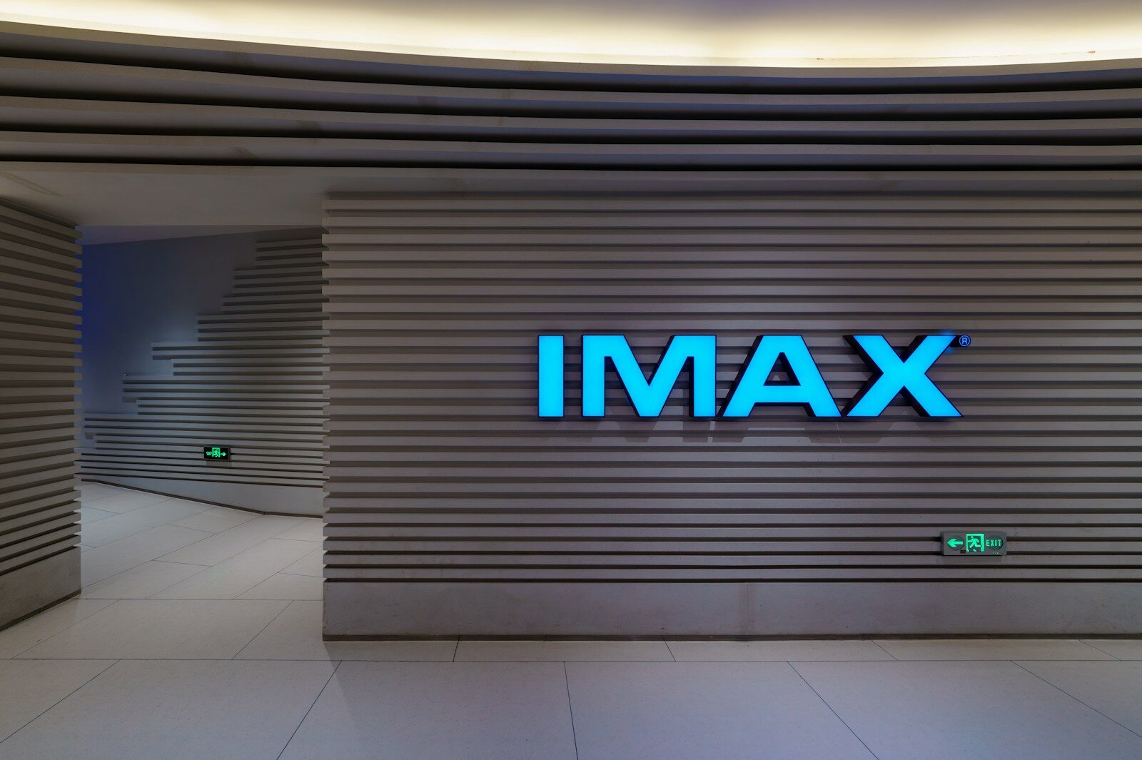 Blue imax sign on a modern cinema wall